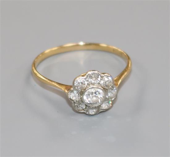 An 18ct gold and diamond cluster ring, size Q.